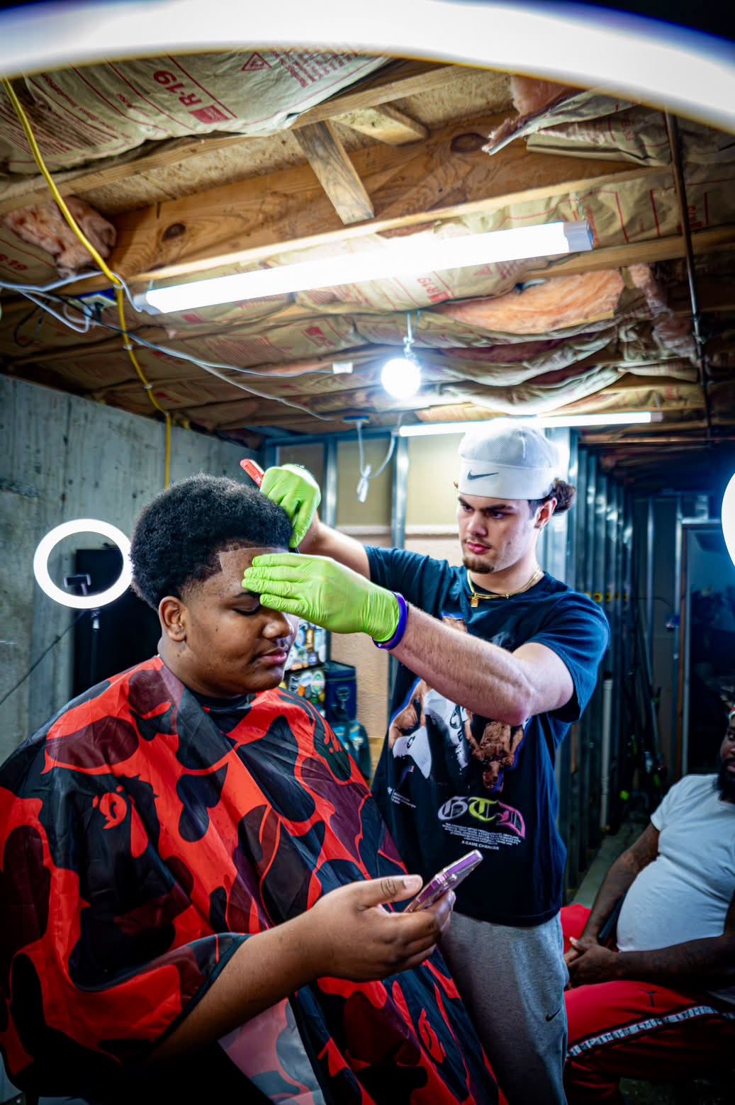 Ryan cutting hair in session