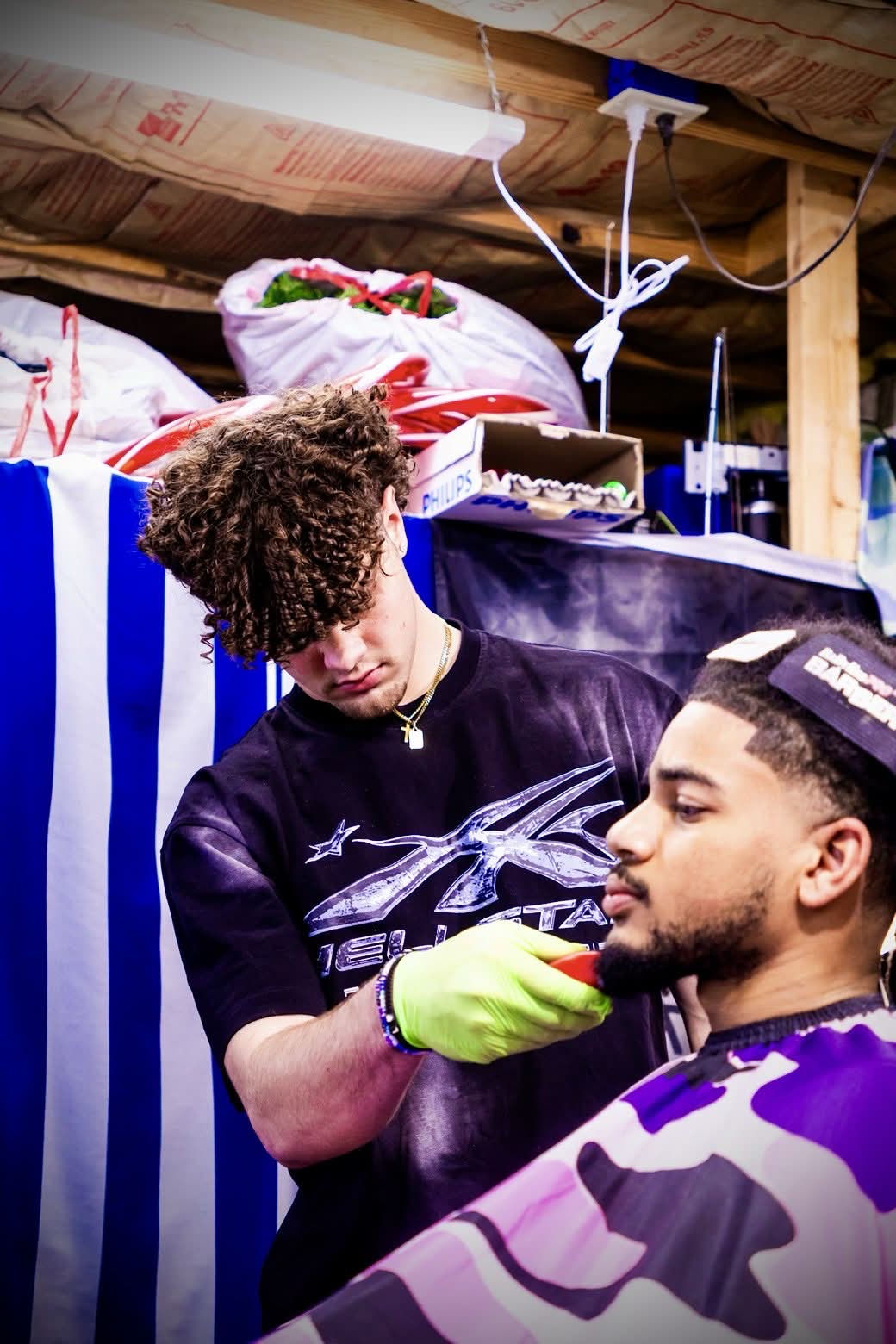 Ryan trimming a client's beard