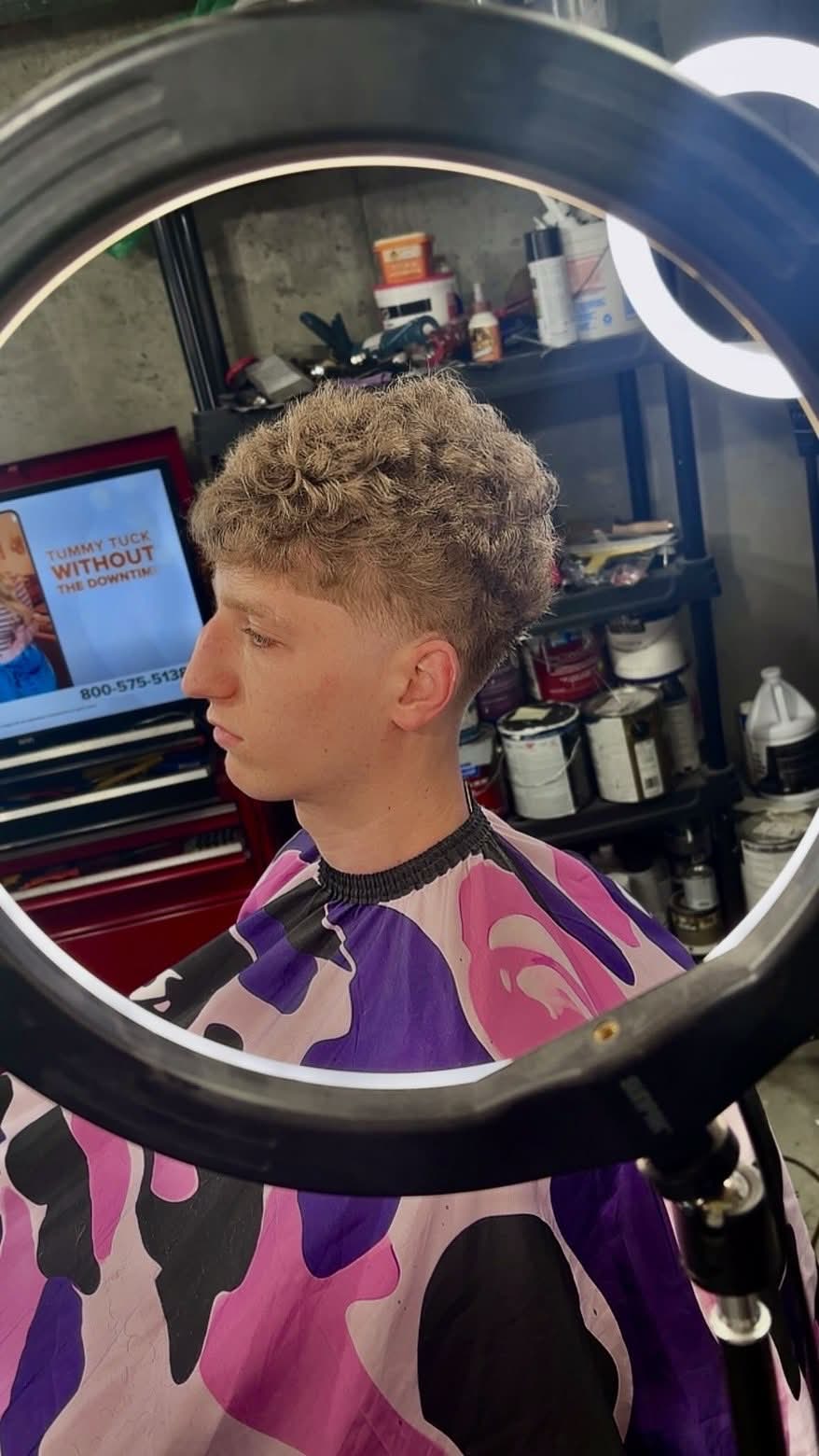 Side profile of a curly burst fade